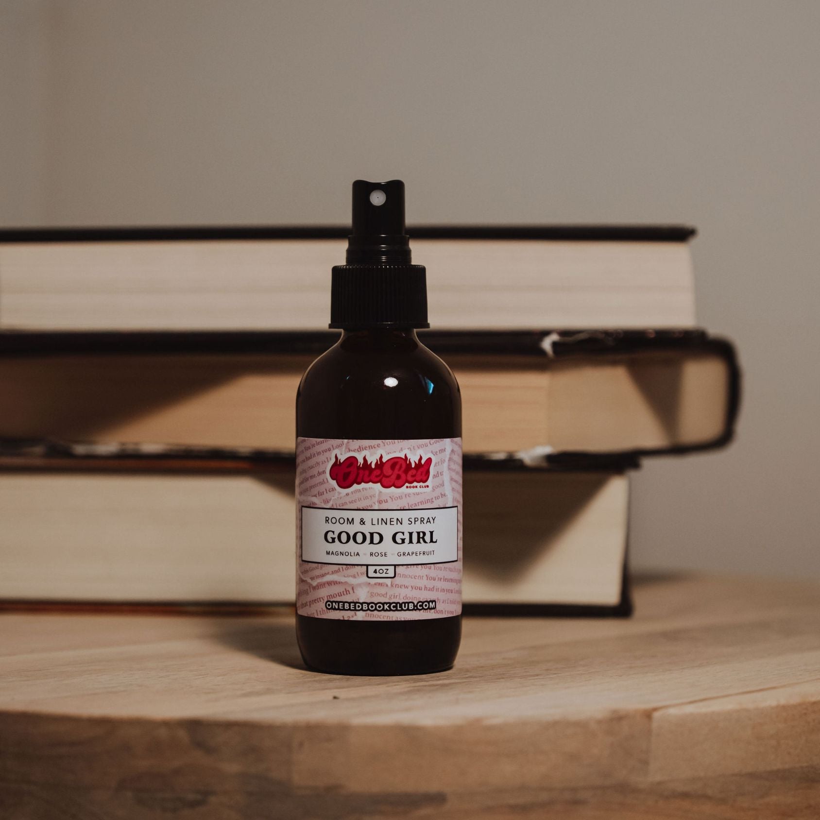 Front-on shot of a single spray bottle with the scent name “Good Girl” clearly shown.